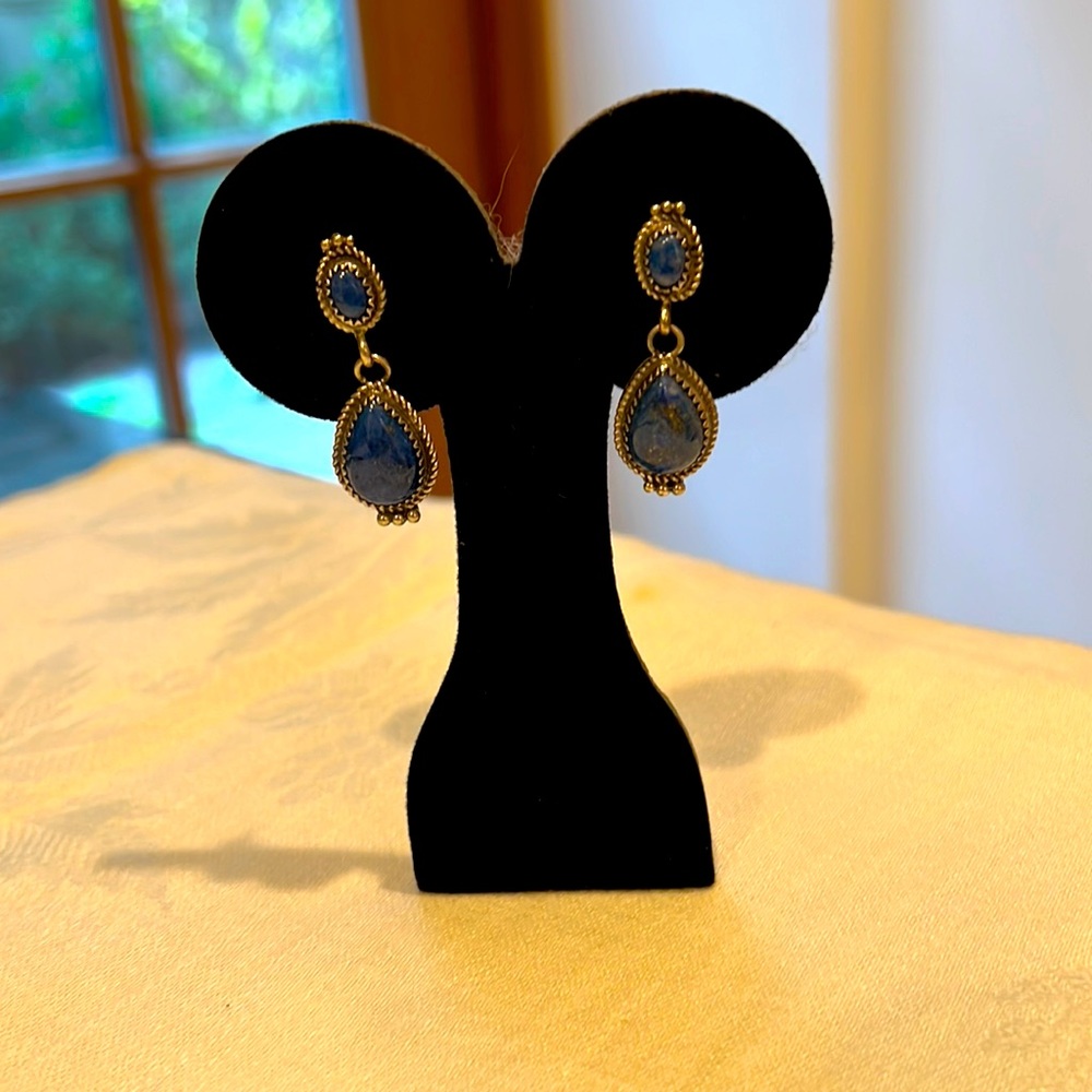 Sterling silver dangle earrings with blue stones.